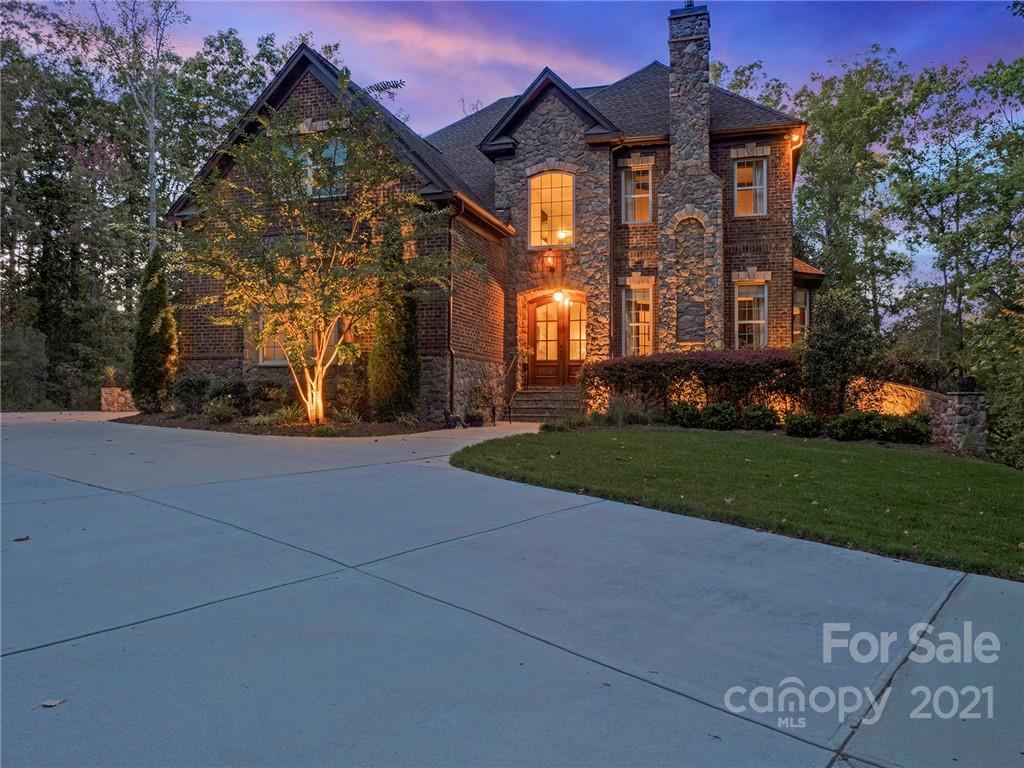2130 Pondmeade Lane Matthews, NC 28104 - Photo 2 of 47 a front view of a house with a yard