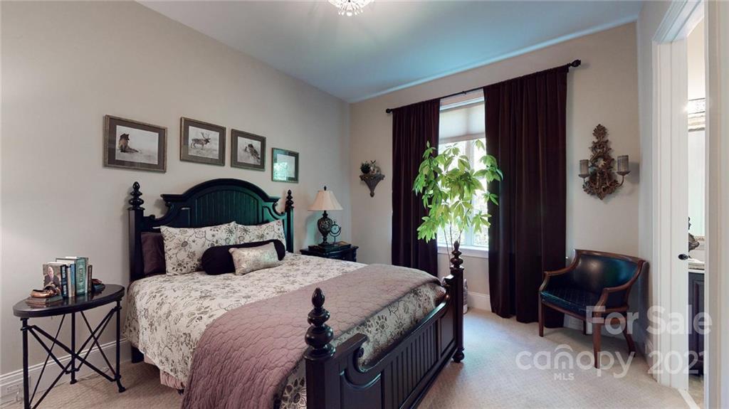2130 Pondmeade Lane Matthews, NC 28104 - Photo 22 of 47 a bedroom with a bed table chair and a window
