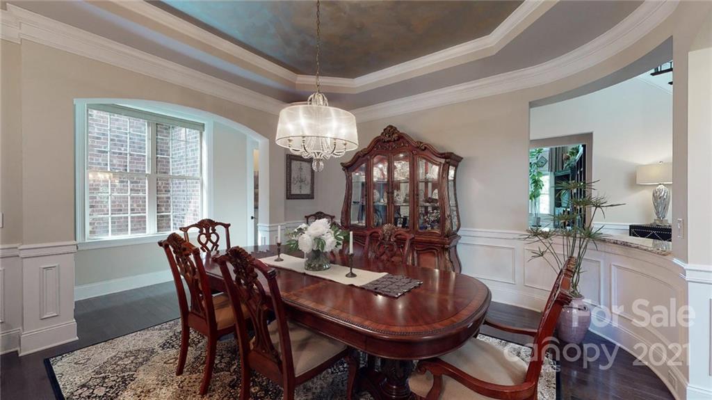 2130 Pondmeade Lane Matthews, NC 28104 - Photo 24 of 47 a view of a dining room with furniture window and wooden floor