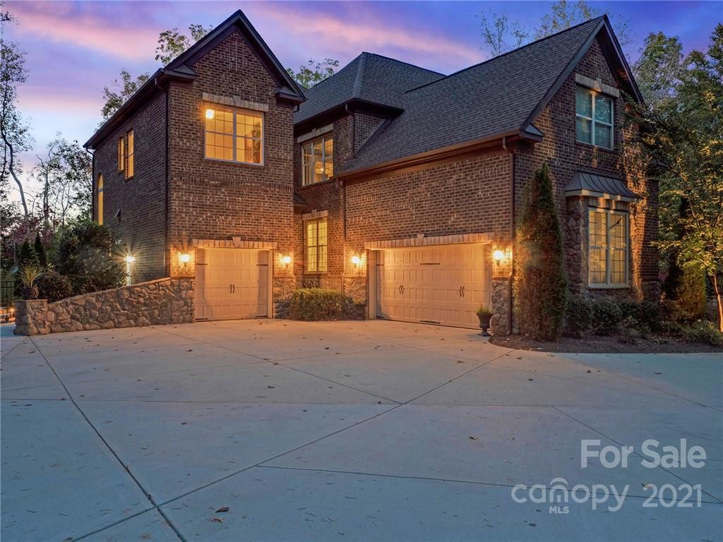 2130 Pondmeade Lane Matthews, NC 28104 - Photo 3 of 47 a front view of a house with a yard and garage