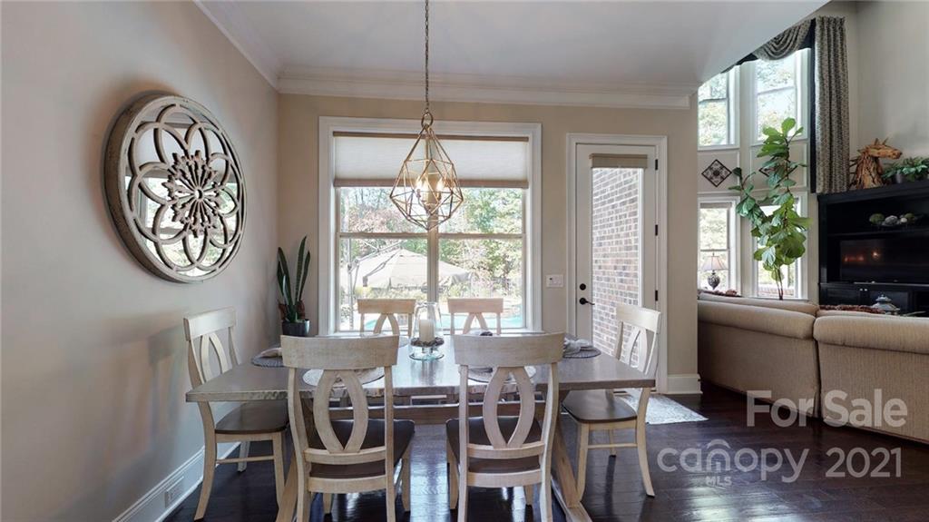 2130 Pondmeade Lane Matthews, NC 28104 - Photo 31 of 47 a view of a dining room with furniture window and wooden floor