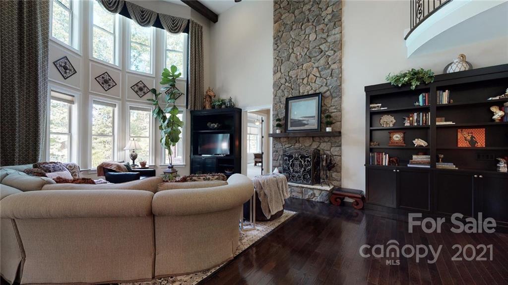 2130 Pondmeade Lane Matthews, NC 28104 - Photo 32 of 47 a living room with fireplace furniture and a window
