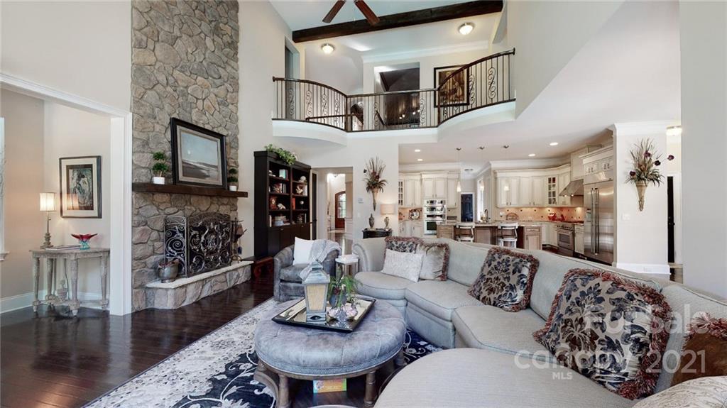 2130 Pondmeade Lane Matthews, NC 28104 - Photo 35 of 47 a living room with furniture or couch and a chandelier