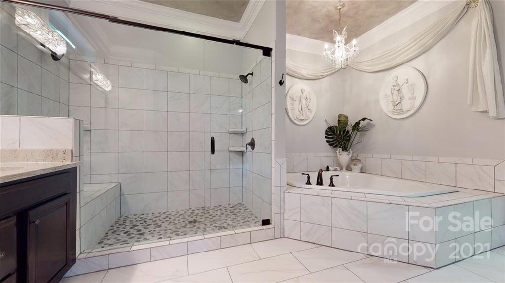 2130 Pondmeade Lane Matthews, NC 28104 - Photo 40 of 47 a bathroom with a sink a toilet and a shower