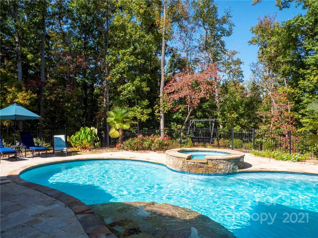 2130 Pondmeade Lane Matthews, NC 28104 - Photo 6 of 47 a swimming pool with an outdoor space and seating area