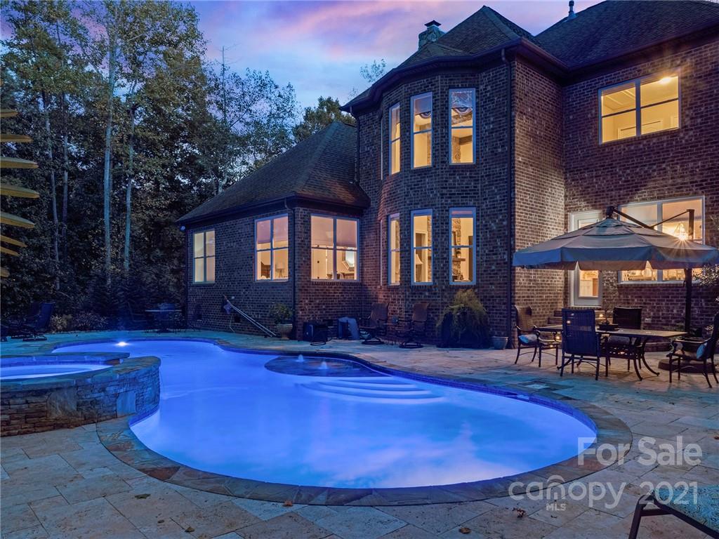 2130 Pondmeade Lane Matthews, NC 28104 - Photo 8 of 47 a view of a house with backyard swimming pool and sitting area
