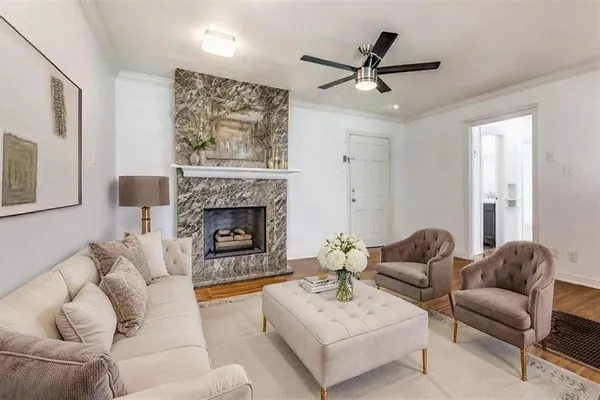 a living room with furniture and a fireplace