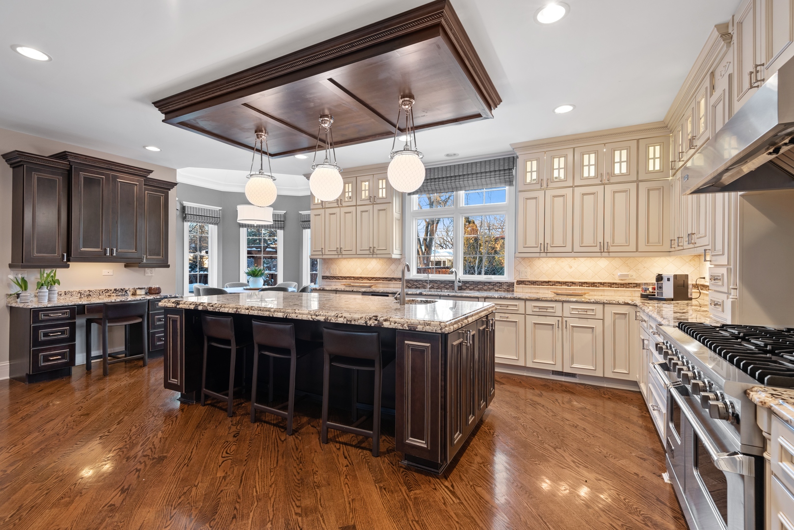 Undisclosed Address Wilmette, IL 60091 - Photo 11 of 57 a kitchen with stainless steel appliances granite countertop a stove and cabinets