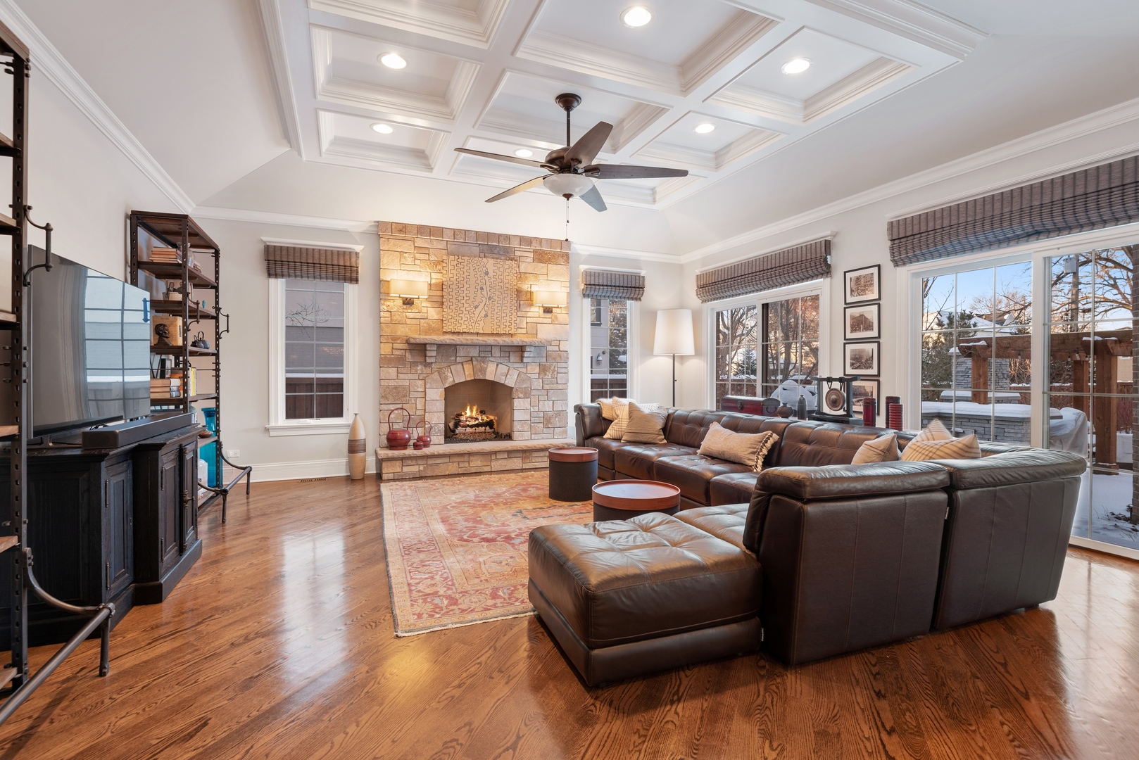 Undisclosed Address Wilmette, IL 60091 - Photo 17 of 57 a living room with furniture a fireplace and a flat screen tv