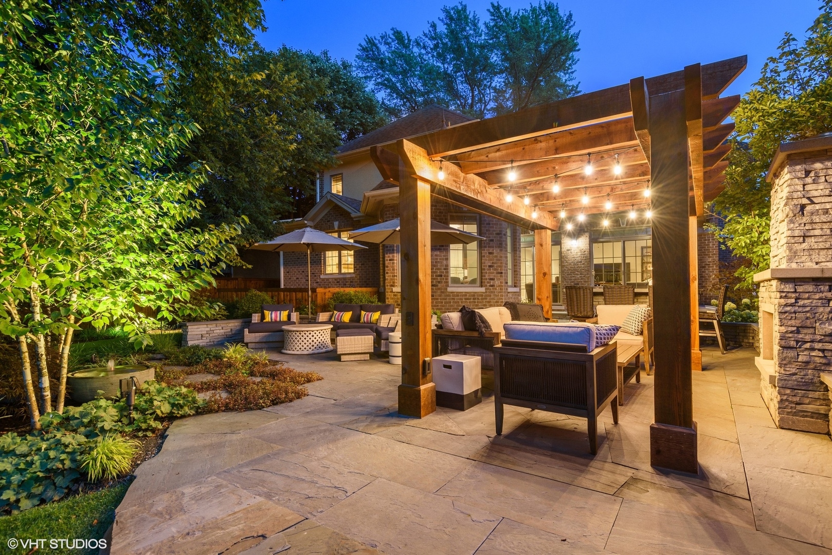 Undisclosed Address Wilmette, IL 60091 - Photo 2 of 57 a view of a patio with table and chairs and potted plants