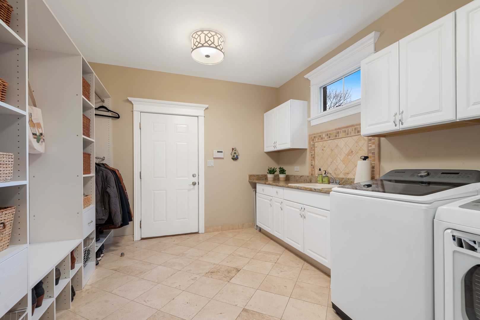 Undisclosed Address Wilmette, IL 60091 - Photo 21 of 57 a kitchen with a sink a refrigerator and cabinets