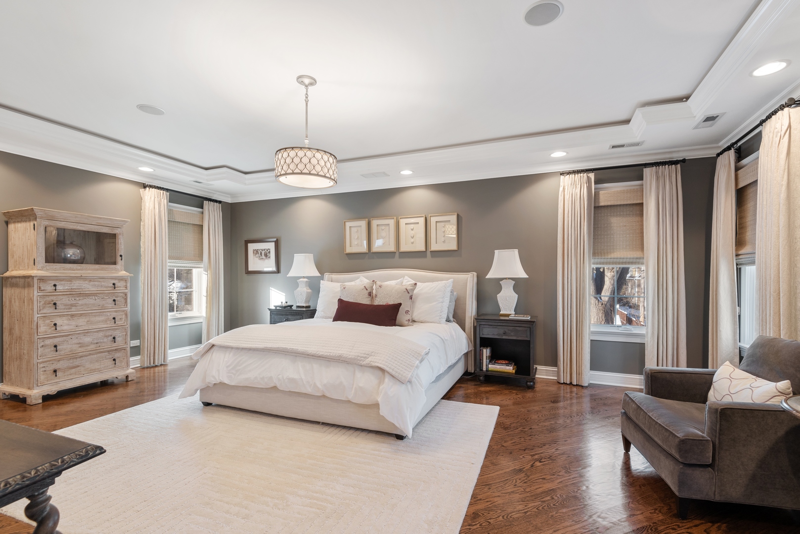 Undisclosed Address Wilmette, IL 60091 - Photo 23 of 57 a spacious bedroom with a bed a couch and dresser