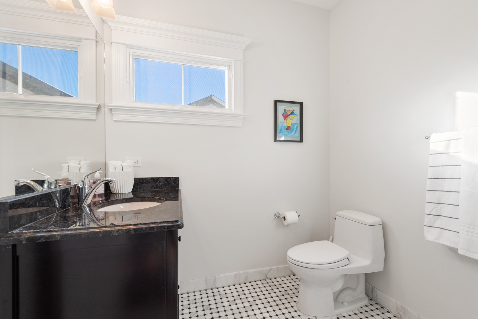 Undisclosed Address Wilmette, IL 60091 - Photo 29 of 57 a bathroom with a granite countertop toilet sink and mirror