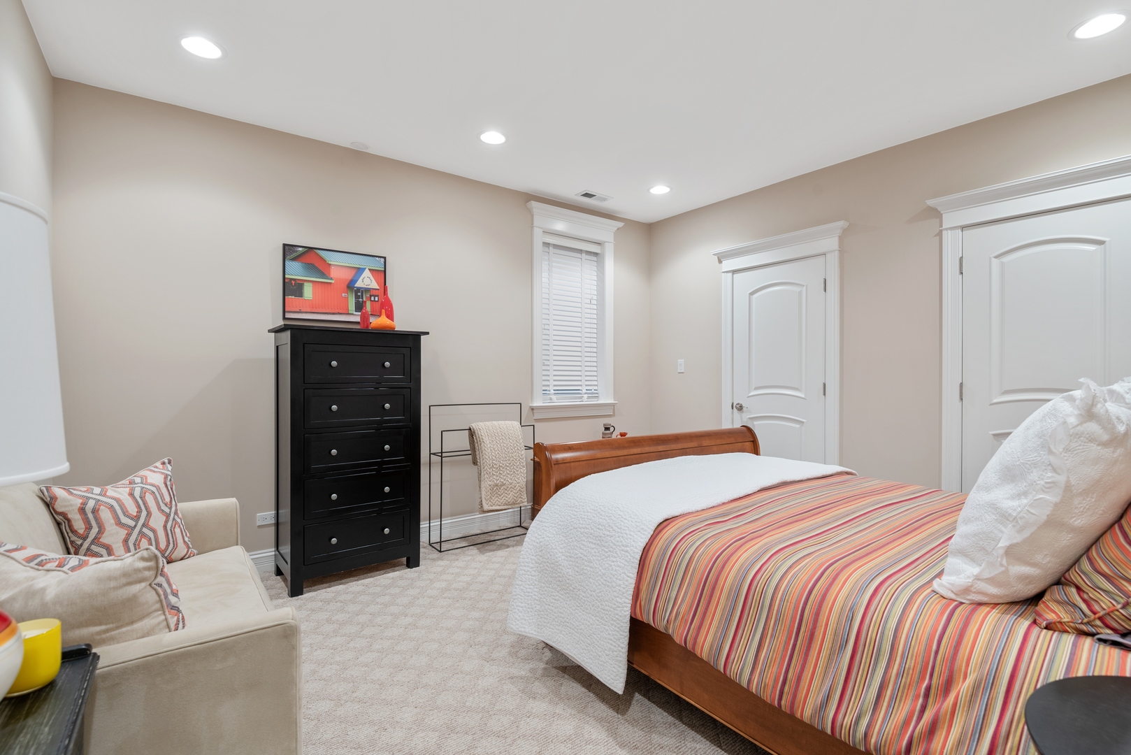 Undisclosed Address Wilmette, IL 60091 - Photo 33 of 57 a bedroom with a bed and a couch