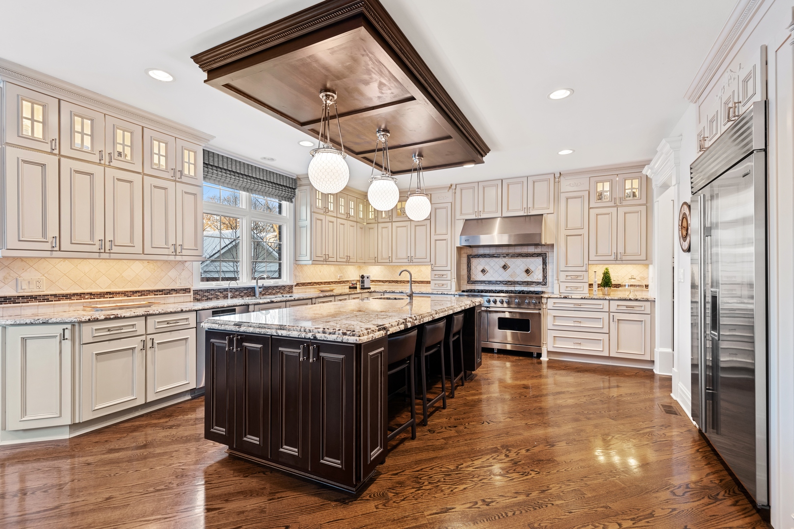 Undisclosed Address Wilmette, IL 60091 - Photo 10 of 57 a kitchen with stainless steel appliances granite countertop a stove and a sink