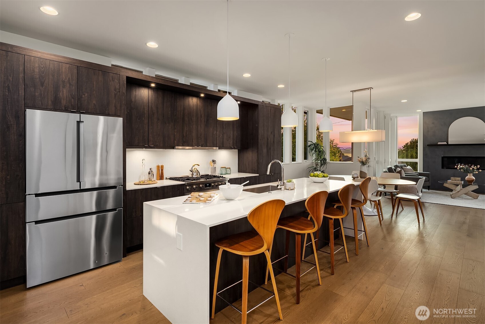 1910 8th Avenue West, Unit B Seattle, WA 98119 - Photo 15 of 40 a kitchen with a refrigerator a dining table and chairs