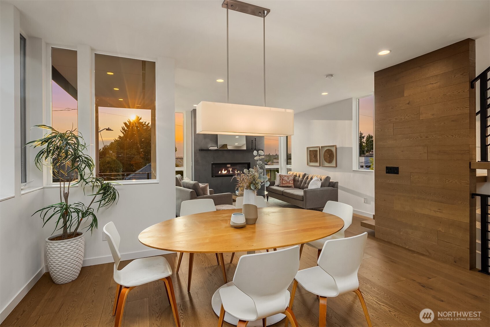 1910 8th Avenue West, Unit B Seattle, WA 98119 - Photo 16 of 40 a kitchen with stainless steel appliances a dining table chairs and couches
