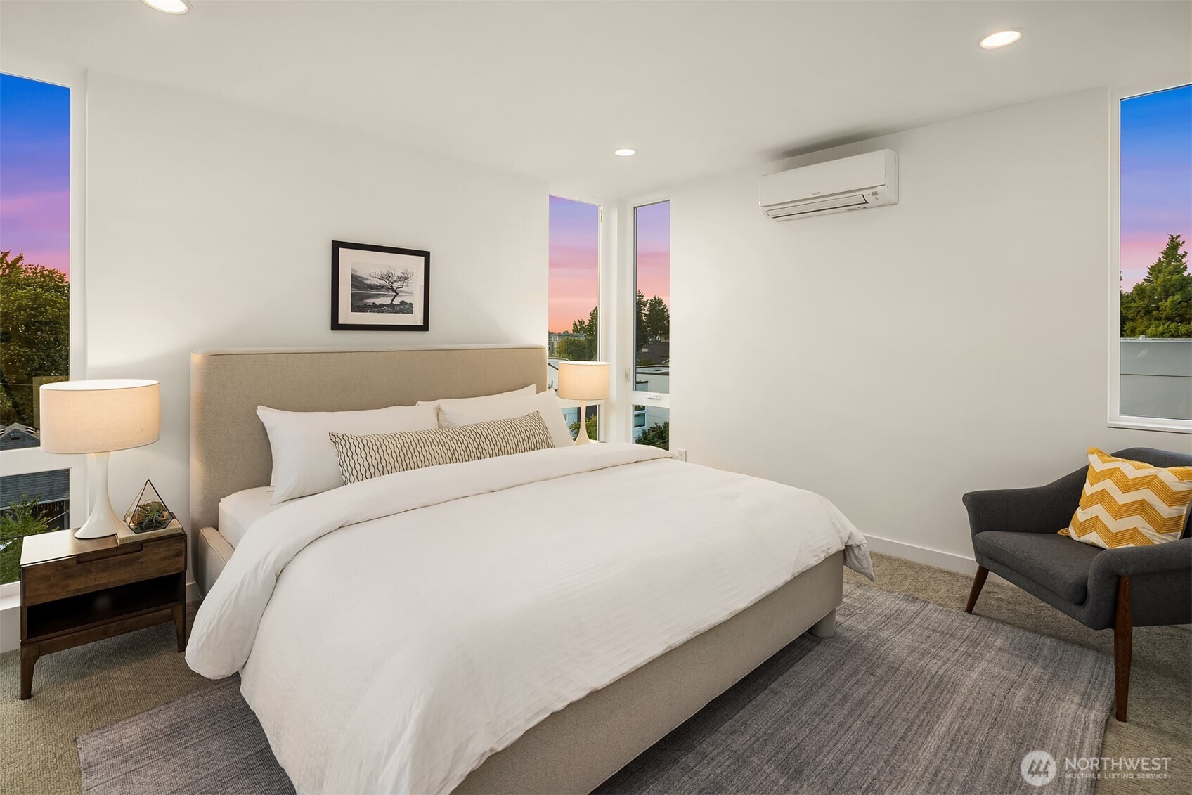 1910 8th Avenue West, Unit B Seattle, WA 98119 - Photo 18 of 40 a bed room with a bed and a chair