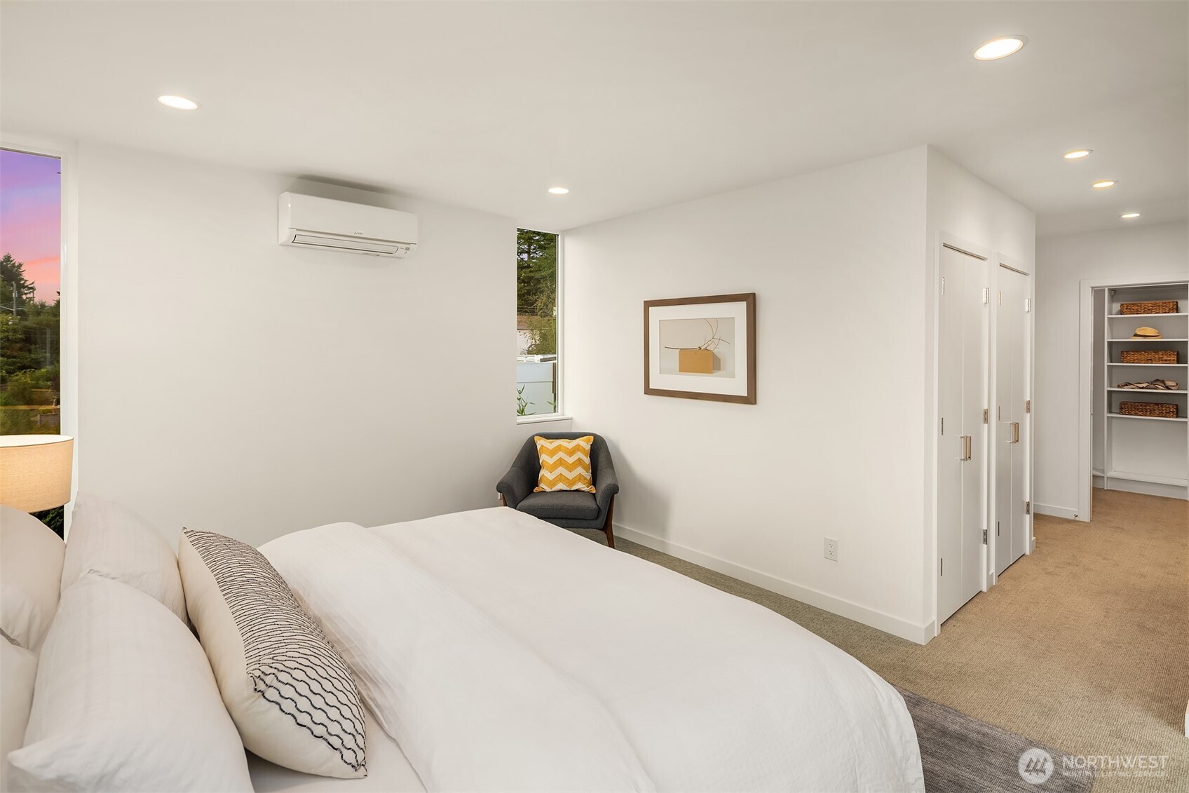 1910 8th Avenue West, Unit B Seattle, WA 98119 - Photo 20 of 40 a bedroom with a bed and a painting