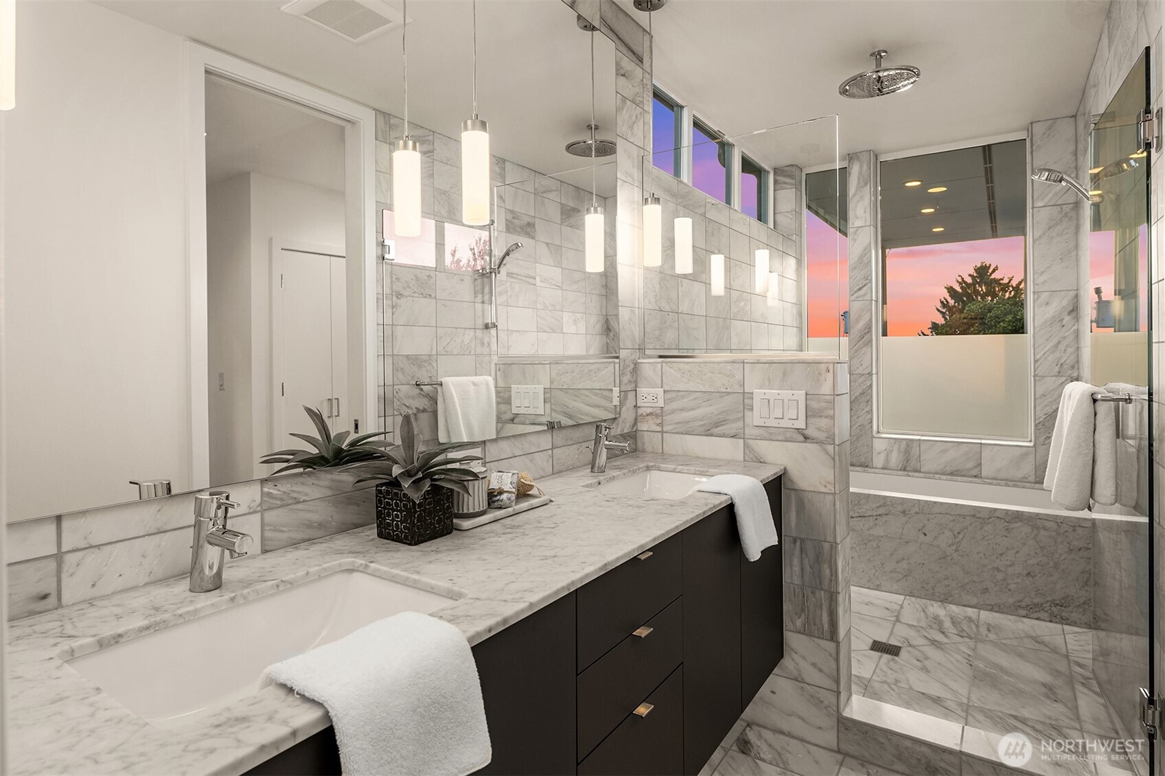 1910 8th Avenue West, Unit B Seattle, WA 98119 - Photo 22 of 40 a bathroom with a double vanity sink mirror and shower