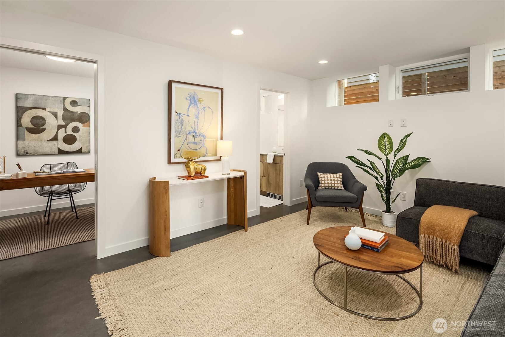 1910 8th Avenue West, Unit B Seattle, WA 98119 - Photo 28 of 40 a living room with furniture potted plant and white walls