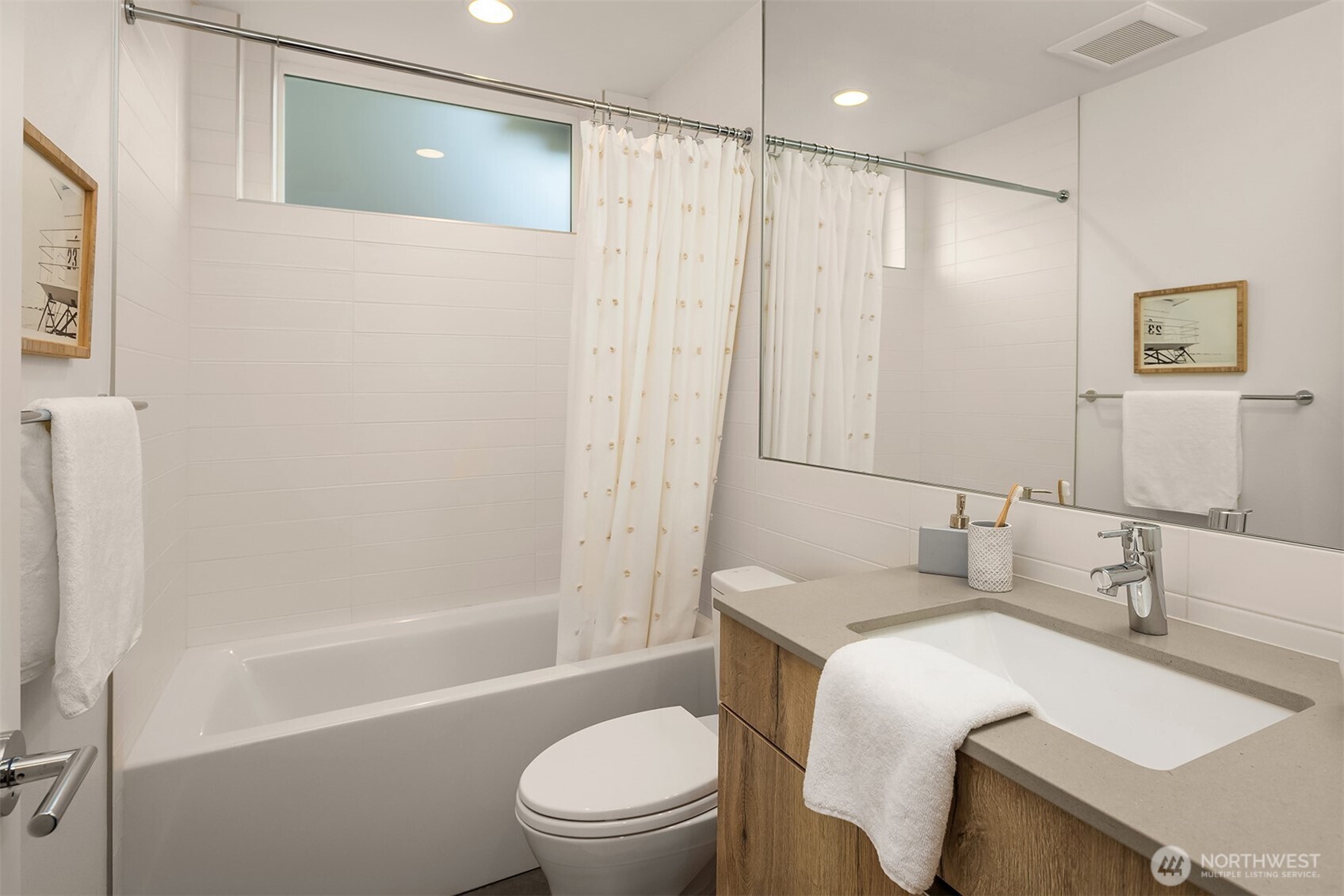 1910 8th Avenue West, Unit B Seattle, WA 98119 - Photo 30 of 40 a bathroom with a sink a toilet and shower