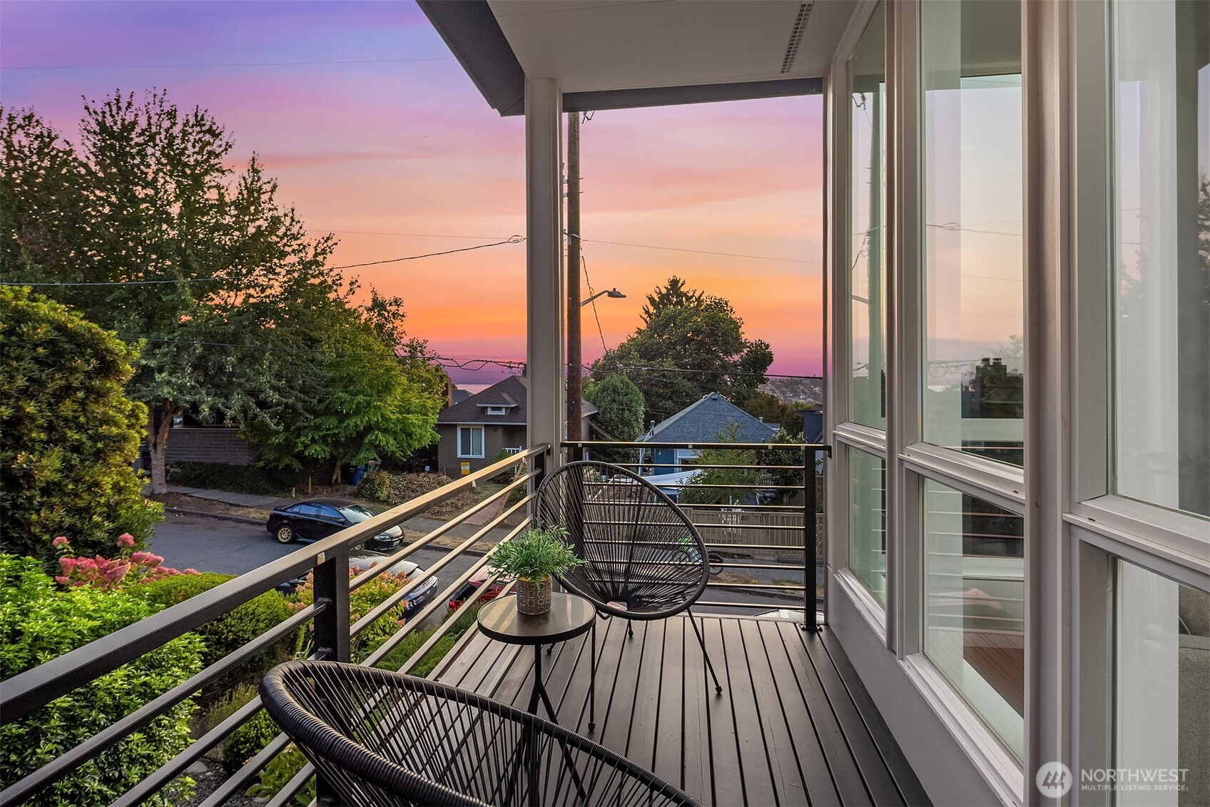 1910 8th Avenue West, Unit B Seattle, WA 98119 - Photo 6 of 40 a view of balcony with wooden floor and fence