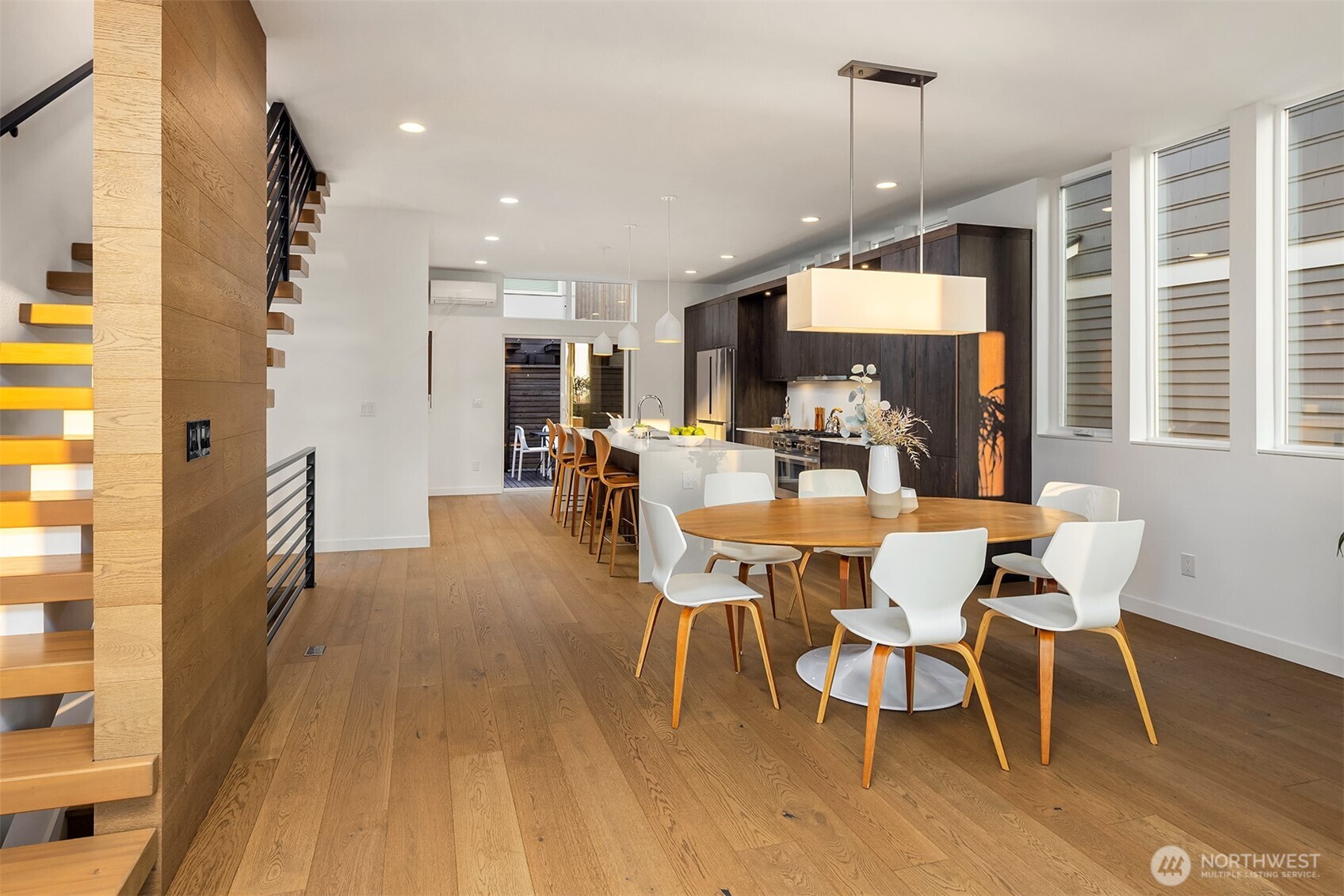 1910 8th Avenue West, Unit B Seattle, WA 98119 - Photo 8 of 40 a view of a dining room with furniture window and wooden floor