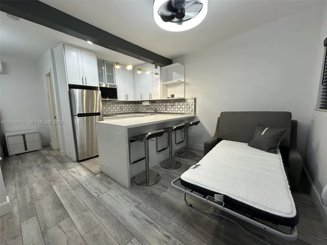 a kitchen with a stove a refrigerator and a stove