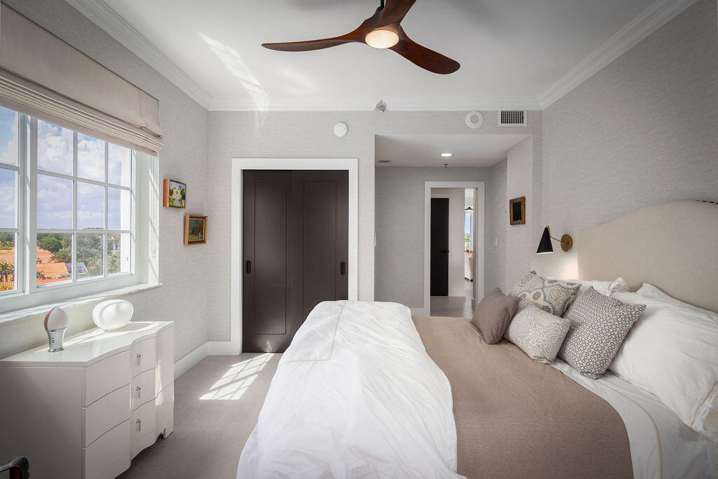 17031 Boca Club Boulevard, Unit 65A Boca Raton, FL 33487 - Photo 19 of 34 a bedroom with a large bed and a window