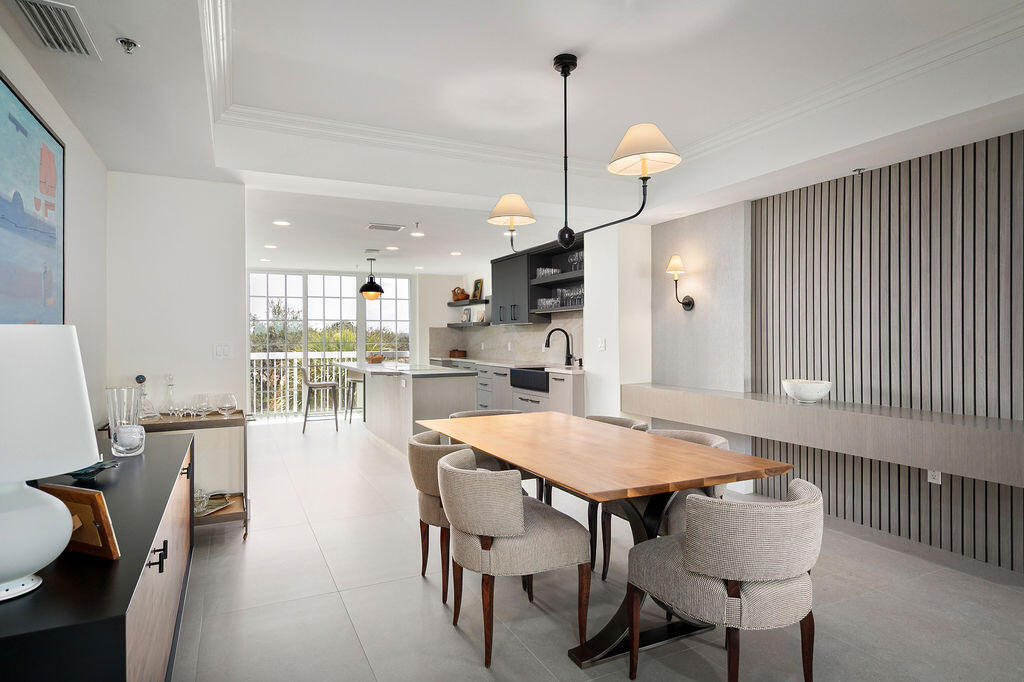17031 Boca Club Boulevard, Unit 65A Boca Raton, FL 33487 - Photo 4 of 34 a dining room with furniture and wooden floor