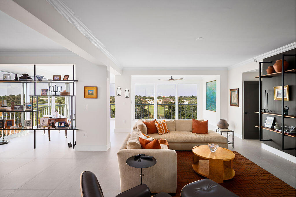 17031 Boca Club Boulevard, Unit 65A Boca Raton, FL 33487 - Photo 10 of 34 a living room with furniture and a large window