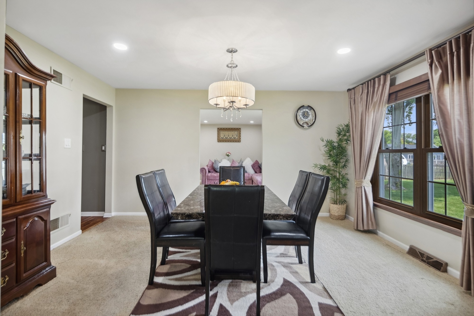 15216 South Clover Court Plainfield, IL 60544 - Photo 5 of 35 a dining room with furniture a rug and a large window