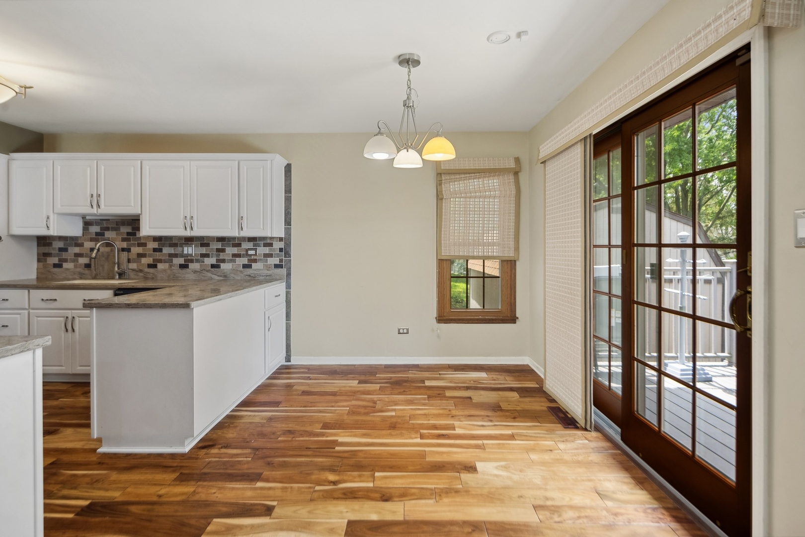 15216 South Clover Court Plainfield, IL 60544 - Photo 8 of 35 a view of a kitchen with microwave and windows