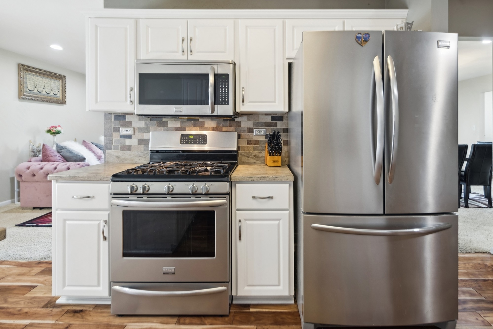 15216 South Clover Court Plainfield, IL 60544 - Photo 10 of 35 a kitchen with stainless steel appliances a refrigerator stove and microwave
