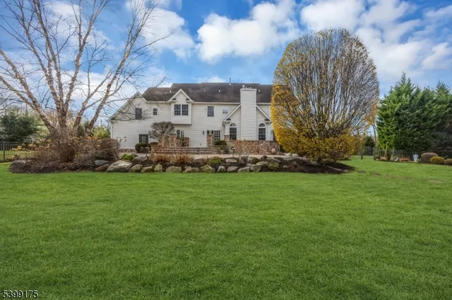 a view of a garden with a house