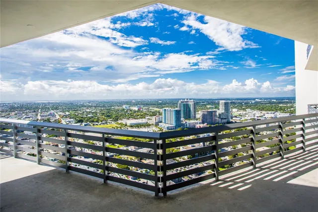 a view of a city with lots of flowers