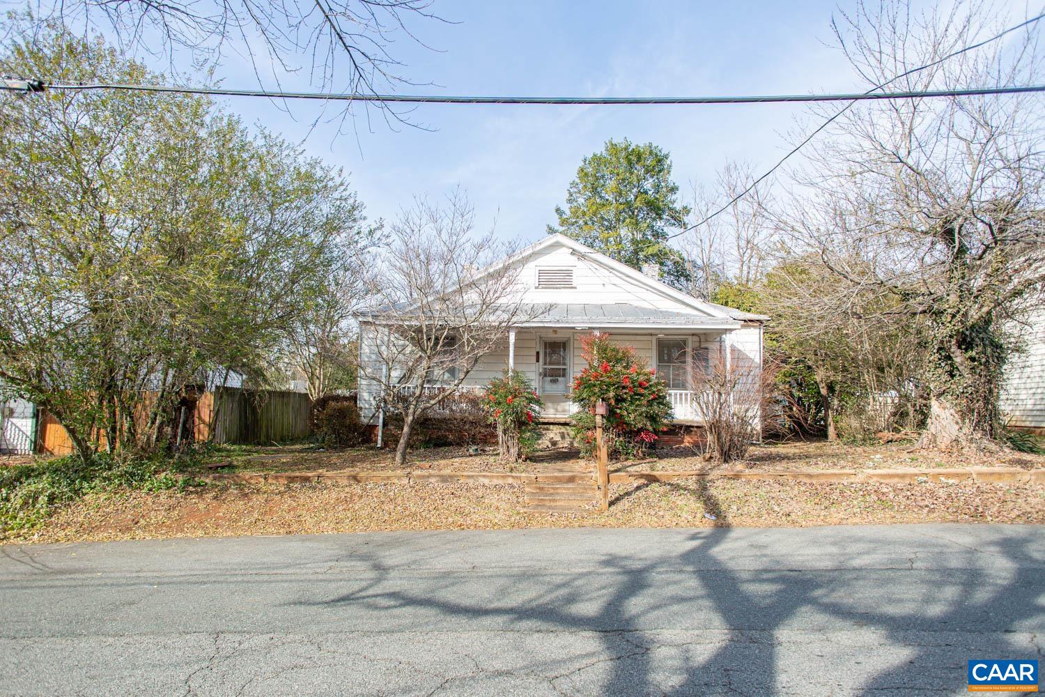 611 Rives Street Charlottesville, VA 22902 - Photo 11 of 18 a view of a patio with a table and chairs under an umbrella
