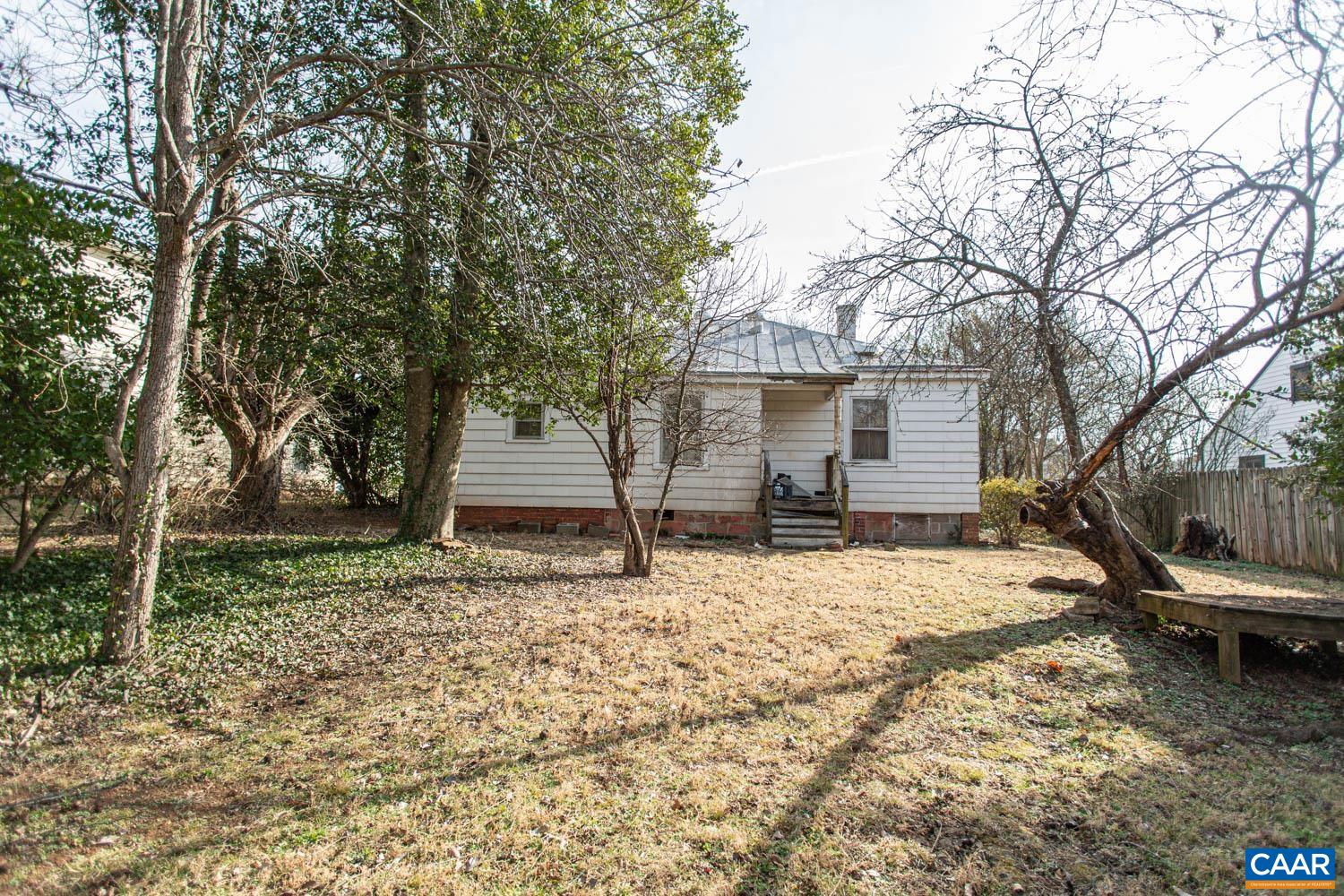 611 Rives Street Charlottesville, VA 22902 - Photo 14 of 18 a backyard of a house with a tree