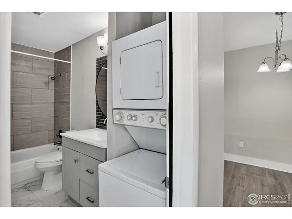 a bathroom with a toilet sink and shower