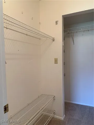 a view of a room with racks on the wall