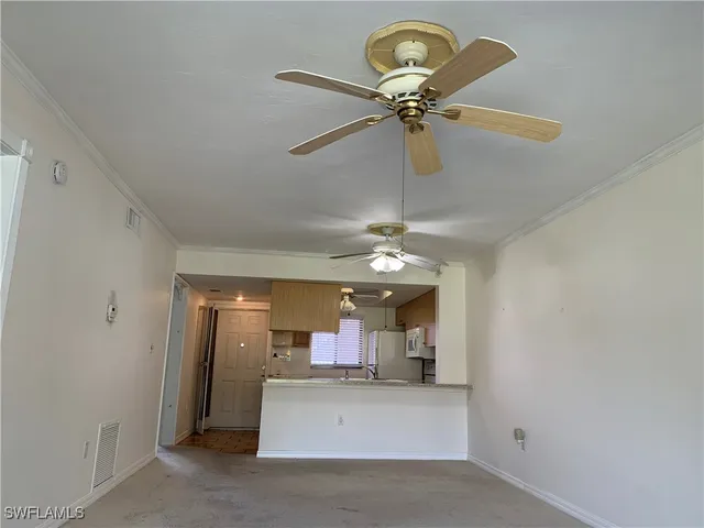 a view of a chandelier and a chandelier fan