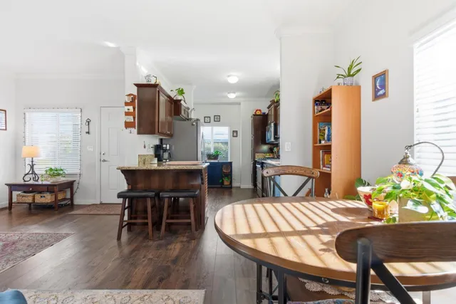 a view of a chairs and table in the balcony