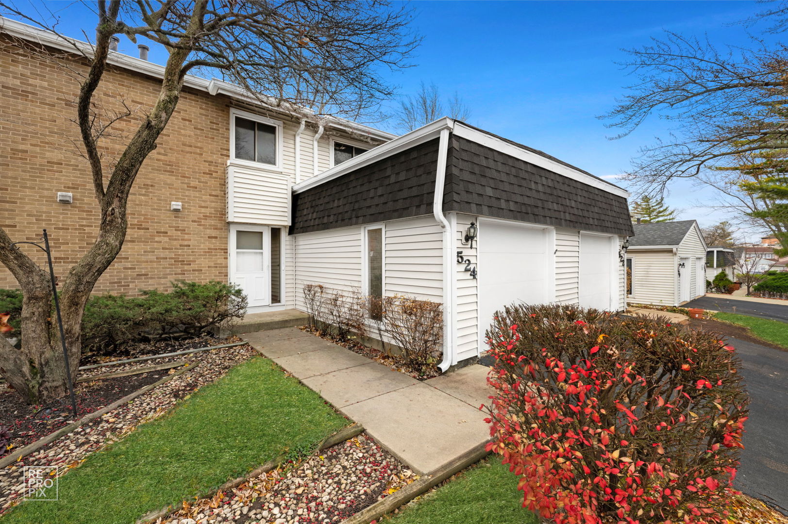 a front view of a house with garden