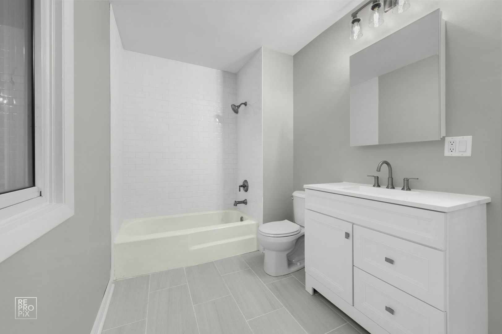 524 Jordan Way Bolingbrook, IL 60440 - Photo 13 of 16 a bathroom with a sink a toilet and a bathtub