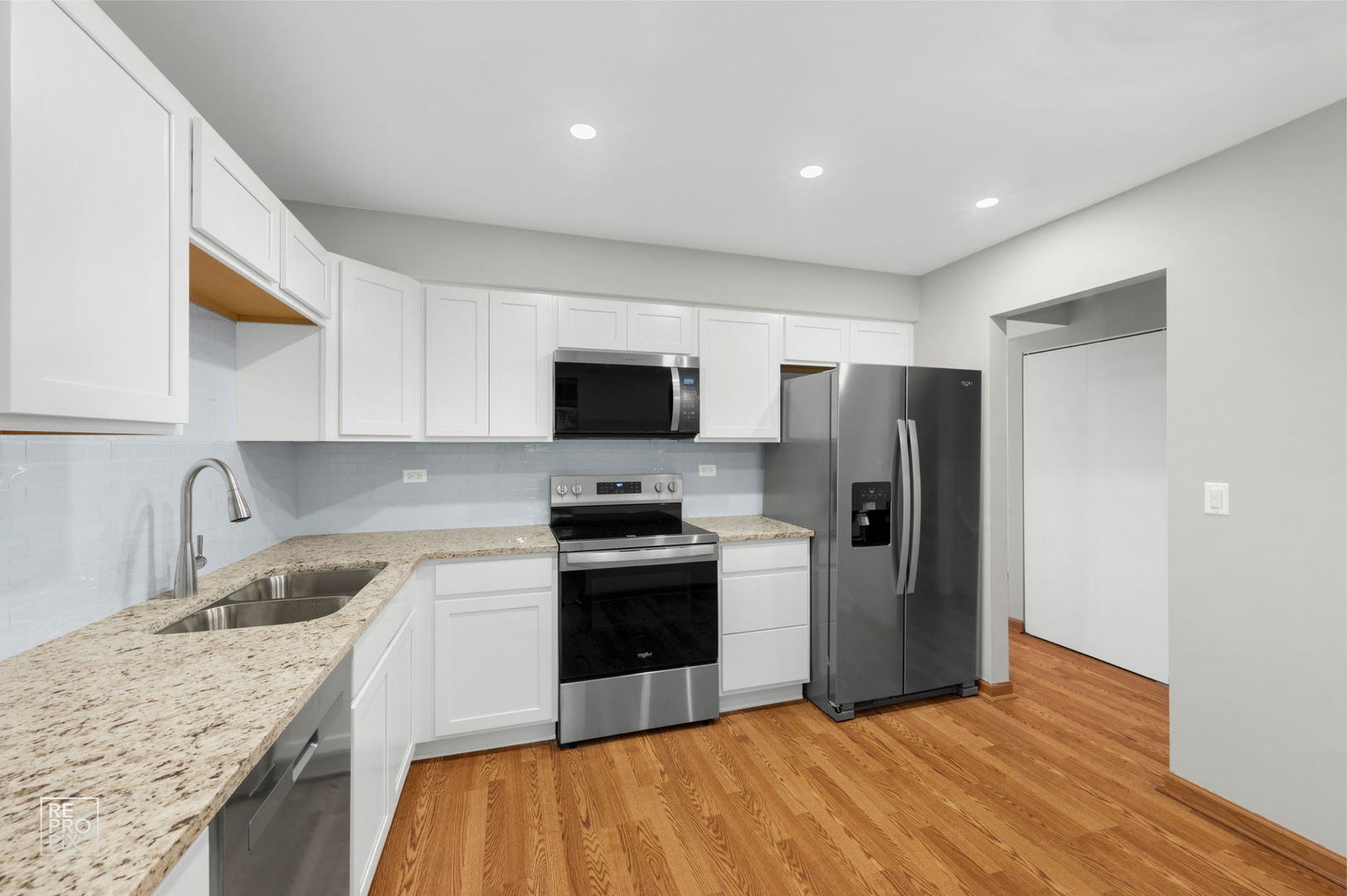 524 Jordan Way Bolingbrook, IL 60440 - Photo 3 of 16 a kitchen with stainless steel appliances granite countertop a refrigerator stove and sink