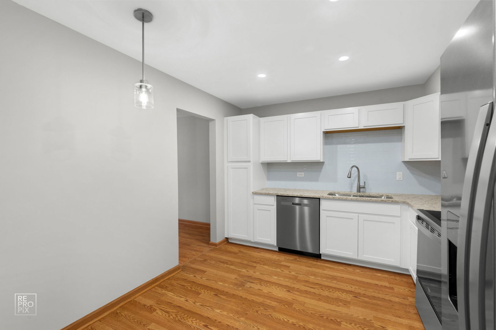 524 Jordan Way Bolingbrook, IL 60440 - Photo 4 of 16 a kitchen with a sink a refrigerator and window