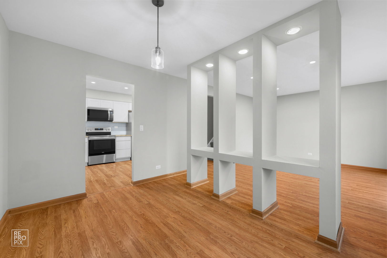 524 Jordan Way Bolingbrook, IL 60440 - Photo 5 of 16 a view of a kitchen with wooden floor and electronic appliances