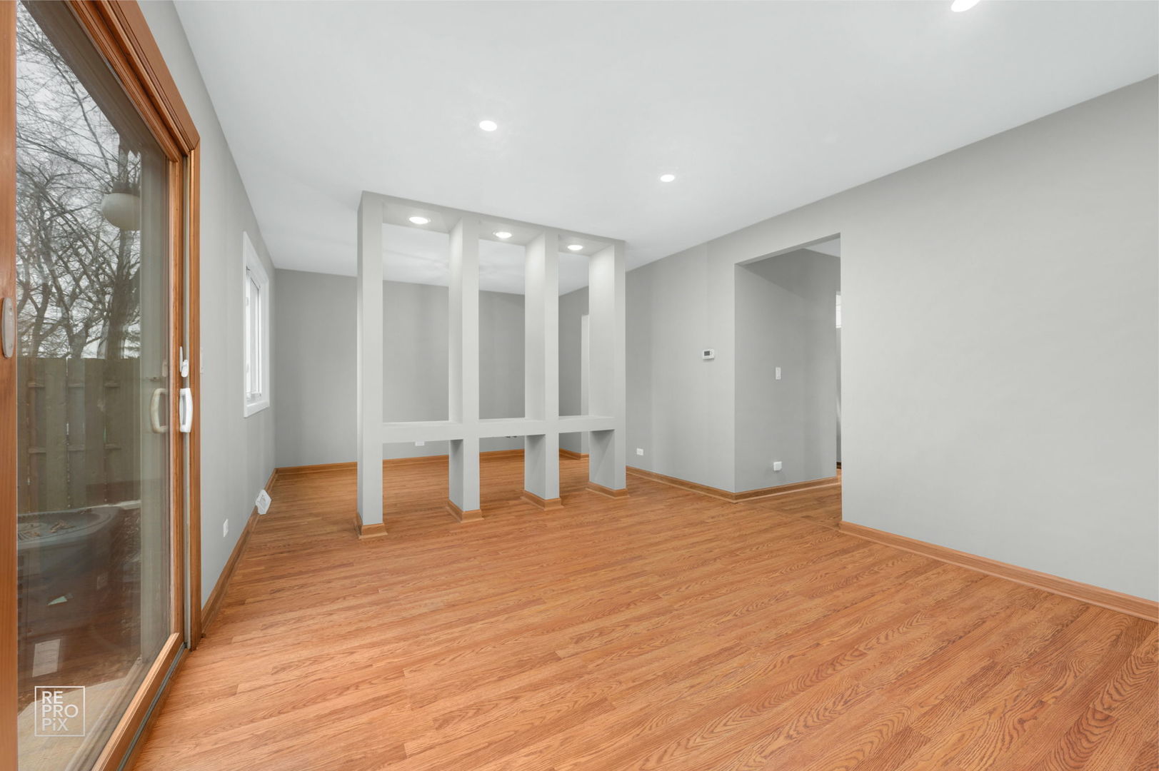524 Jordan Way Bolingbrook, IL 60440 - Photo 7 of 16 a view of empty room with wooden floor and fence