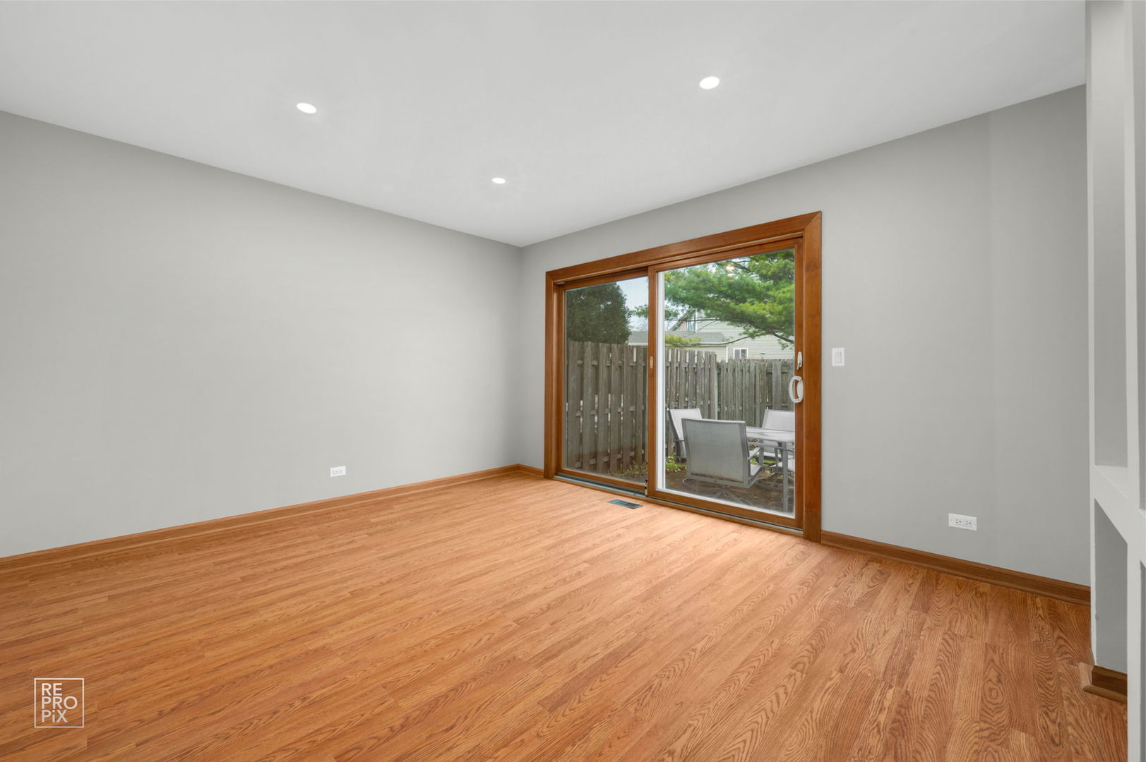 524 Jordan Way Bolingbrook, IL 60440 - Photo 8 of 16 a view of an empty room with wooden floor and a window